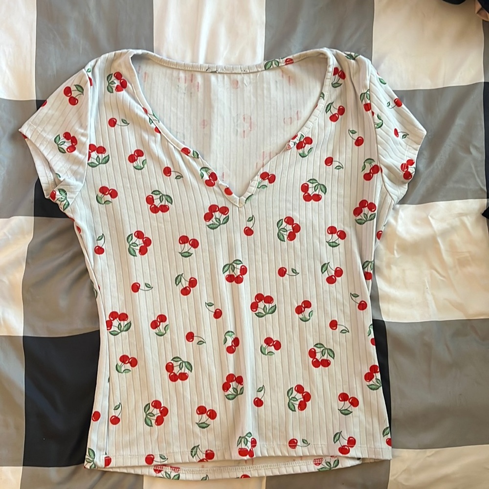 White shirt with red cherries